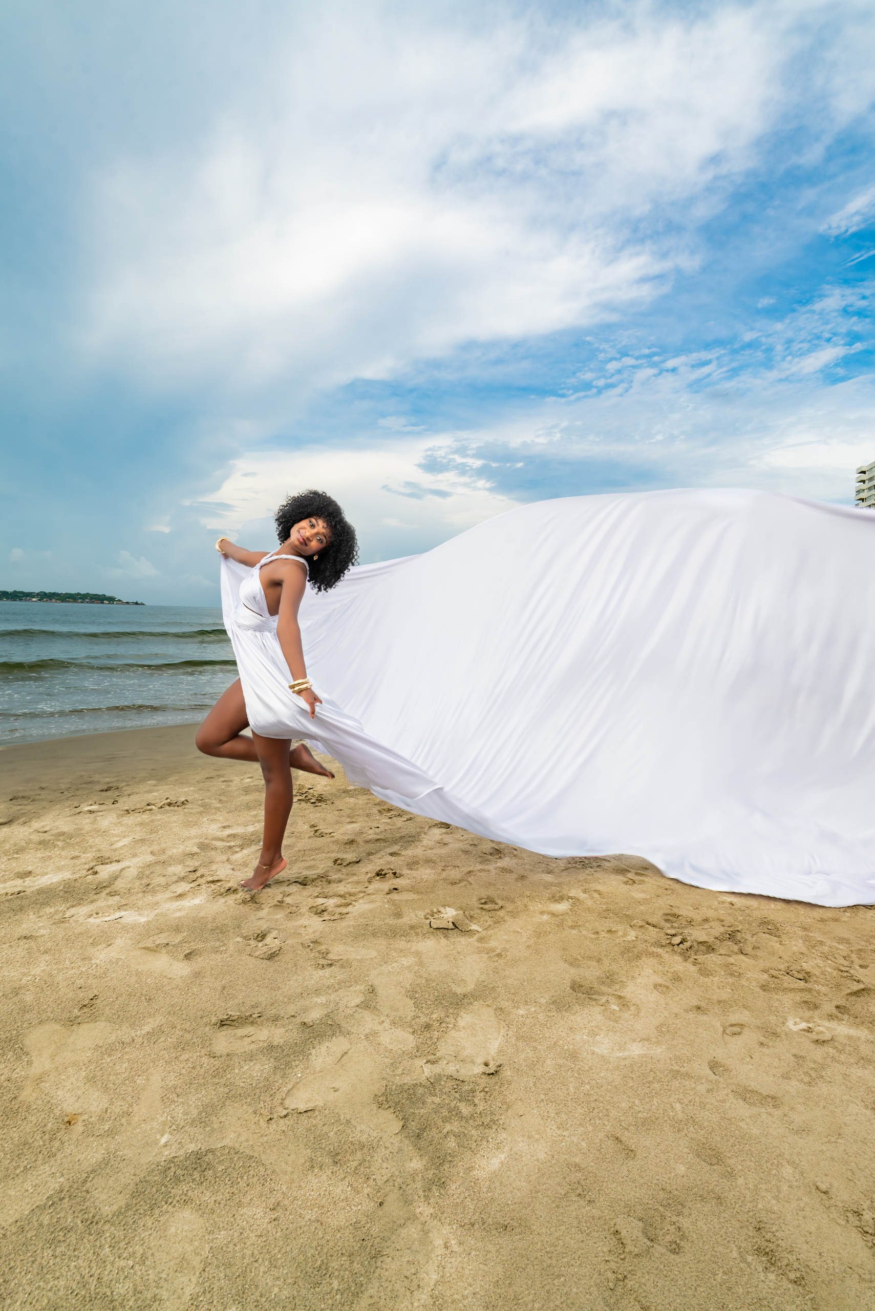 White flying dress photoshoot on the beach in Cartagena Colombia